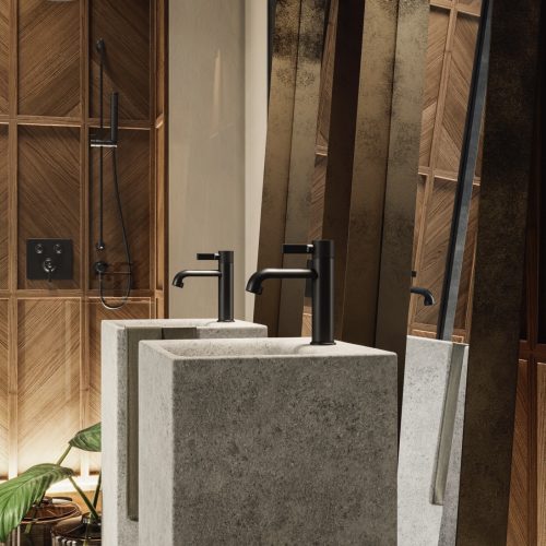 Modern bathroom featuring two stone pedestal sinks with sleek black faucets. Wood-paneled walls create a warm ambiance. A shower area with a black showerhead is visible in the background, and a potted plant adds a touch of greenery.