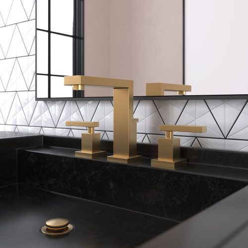 Modern bathroom with a gold faucet set against a black countertop and geometric white tile backsplash. A large mirror reflects the design, under soft lighting.